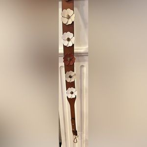 Clearly brand leather purse strap.